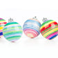 6 colorful striped plastic ornaments with silver caps