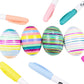 Image showing a variety of colorful markers and four striped eggs. Colors include bright pink, mint green, light blue, peach, turquoise, yellow, light pink, and light purple. 