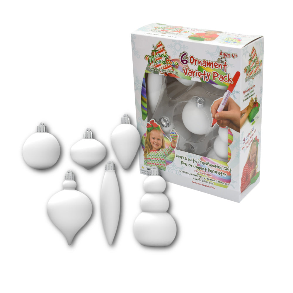 Colorful box with white plastic ornaments inside and 6 white plastic ornaments of different shapes to the side.